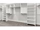 Walk-in closet features custom built-in shelving and ample storage space at 2032 Se 27Th Rd, Ocala, FL 34471