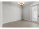 Dining area featuring tile floors, trim, light fixture, and a glass door at 2032 Se 27Th Rd, Ocala, FL 34471