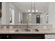 Kitchen with a breakfast bar overlooking the living room, showcasing stainless steel appliances and granite countertops at 2032 Se 27Th Rd, Ocala, FL 34471