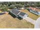 Expansive aerial view of home showcasing rear yard, patio and attached two-car garage at 2032 Se 27Th Rd, Ocala, FL 34471