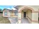 Inviting front entrance with decorative tile walkway, arched entryway, and stylish security door, offering curb appeal at 21353 Sw Beach Blvd, Dunnellon, FL 34431