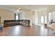 Spacious living room featuring wood floors and ample seating with natural lighting at 2209 Nw 55Th Avenue Rd, Ocala, FL 34482