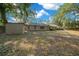 Large backyard with storage shed and mature trees, offering plenty of space for recreation at 2923 Se 14Th St, Ocala, FL 34471