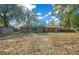 View of the backyard showcasing the size of the lot and the covered patio area at 2923 Se 14Th St, Ocala, FL 34471