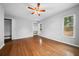 Bright bedroom features hardwood floors, a ceiling fan, and two closets with built-in shelves at 2923 Se 14Th St, Ocala, FL 34471