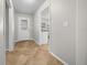 Bright foyer with tile flooring, a decorative front door, and an open view into the kitchen at 2923 Se 14Th St, Ocala, FL 34471