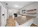 Bright kitchen with stainless steel appliances, white cabinets, and granite countertops at 2923 Se 14Th St, Ocala, FL 34471