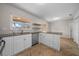 Bright kitchen with stainless steel appliances, white cabinets, and granite countertops at 2923 Se 14Th St, Ocala, FL 34471