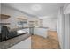 Bright kitchen with stainless steel appliances, white cabinets, and granite countertops at 2923 Se 14Th St, Ocala, FL 34471