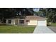 Charming single-story home with a well-manicured lawn and inviting curb appeal at 3373 Se 148Th Pl, Summerfield, FL 34491