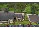 Overhead view of condo building with landscaped grounds and ample parking at 3437 E Fort King St # 220, Ocala, FL 34470