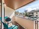 Cozy balcony with seating overlooking the parking area at 3437 E Fort King St # 220, Ocala, FL 34470