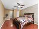 Spacious main bedroom features cherry tone wood floors at 3437 E Fort King St # 220, Ocala, FL 34470