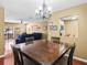 Open dining room with view into living area at 3437 E Fort King St # 220, Ocala, FL 34470