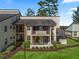 Multi-story building with balconies, landscaping, and walkway at 3437 E Fort King St # 220, Ocala, FL 34470