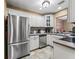 Well-lit kitchen featuring stainless steel appliances, light countertops, and tile backsplash at 3437 E Fort King St # 220, Ocala, FL 34470