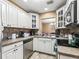 Kitchen featuring white cabinets, stainless steel appliances, and tile backsplash at 3437 E Fort King St # 220, Ocala, FL 34470