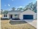 Charming new construction home featuring a modern farmhouse design, dark accents, and a well-manicured lawn at 3684 Se 130Th Pl, Belleview, FL 34420