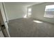 Spacious bedroom featuring neutral carpet, plenty of natural light, and a calming atmosphere at 3969 Ne 30Th Ter, Ocala, FL 34479