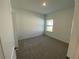 Cozy bedroom with neutral carpet, a window, and ample closet space at 3969 Ne 30Th Ter, Ocala, FL 34479