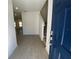 Inviting entryway with wood-look tile floors leading to the staircase and main living areas at 3969 Ne 30Th Ter, Ocala, FL 34479