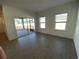 Bright living room with a sliding glass door and wood-look tile floors at 3969 Ne 30Th Ter, Ocala, FL 34479