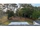 A lovely backyard features mature trees and a fenced in area, offering a serene outdoor space at 4480 Ne 25Th Ave, Ocala, FL 34479