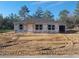 New construction home featuring a gray roof, white siding, and a charming front porch ready for customization at 46 Malauka Dr, Ocklawaha, FL 32179