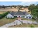 Stunning aerial view of a stately home with a circular driveway and lush, manicured landscaping at 4620 Nw 84Th Ter, Ocala, FL 34482