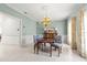 Charming dining room featuring a chandelier, patterned wallpaper, and classic furnishings at 4620 Nw 84Th Ter, Ocala, FL 34482