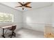 Bright office featuring tile floor, a wooden desk, and natural light from the window at 4620 Nw 84Th Ter, Ocala, FL 34482