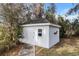 Exterior of white shed showing door and window at 4620 Nw 84Th Ter, Ocala, FL 34482