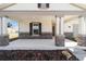 Inviting covered front porch with stone-clad columns and a view of the well-maintained yard at 5589 Sw 78Th Ave Rd, Ocala, FL 34474