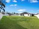 A huge backyard is fully fenced, and has a large lawn for entertainment and games at 5898 Sw 116Th Street Rd, Ocala, FL 34476