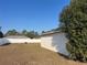 The backyard is surrounded by a white fence, which offers privacy at 61 Pecan Drive Loop, Ocala, FL 34472