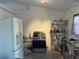 A kitchen featuring appliances, shelving, and a sink area at 61 Pecan Drive Loop, Ocala, FL 34472