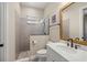 Tiled bathroom featuring glass shower, neutral colors, and bright vanity at 6174 Spinnaker Loop, Lady Lake, FL 32159