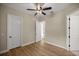 Bright, empty room features wood floors and two doors at 6174 Spinnaker Loop, Lady Lake, FL 32159