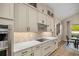 Close up of the modern kitchen with stainless appliances and designer backsplash at 6174 Spinnaker Loop, Lady Lake, FL 32159