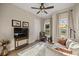 Stylish living room features comfortable seating, wood floors, and natural light at 6174 Spinnaker Loop, Lady Lake, FL 32159