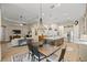 Open-concept layout with the dining area flowing into the living room and kitchen at 6174 Spinnaker Loop, Lady Lake, FL 32159