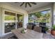 An outdoor kitchen with a built-in grill is visible from the covered patio at 6174 Spinnaker Loop, Lady Lake, FL 32159