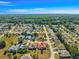 Bird's-eye view of a tranquil neighborhood with lush greenery, mature trees, and well-maintained lawns at 7451 Sw 111Th Pl, Ocala, FL 34476