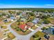 Lovely aerial view of a single-story home in a quiet neighborhood with mature trees and well-kept lawns at 7451 Sw 111Th Pl, Ocala, FL 34476