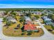 An aerial view of a cozy neighborhood with a well-manicured lawns and mature trees at 7451 Sw 111Th Pl, Ocala, FL 34476