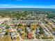 Picturesque aerial view of a vibrant community with lush greenery, mature trees, and well-maintained lawns at 7451 Sw 111Th Pl, Ocala, FL 34476