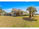 Backyard showcasing lush landscaping and a beautifully maintained lawn at 7451 Sw 111Th Pl, Ocala, FL 34476