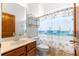 Bathroom featuring a wood vanity, tile flooring, and a shower with a themed curtain at 7451 Sw 111Th Pl, Ocala, FL 34476