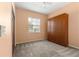 Bedroom featuring a built-in wardrobe, neutral carpet, and bright window at 7451 Sw 111Th Pl, Ocala, FL 34476