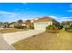 Charming single-story home with brick-paved driveway, two-car garage, and a well-maintained lawn at 7451 Sw 111Th Pl, Ocala, FL 34476